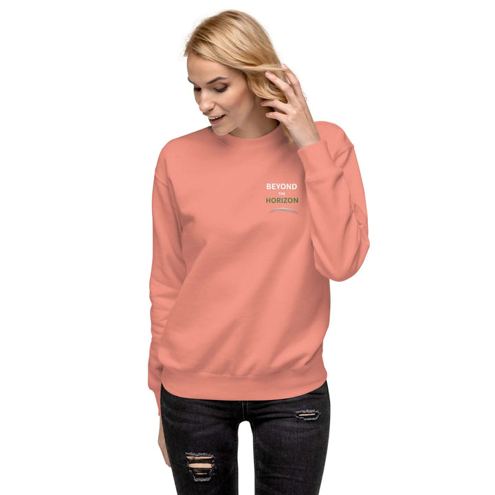 Model wearing Beyond the Horizon Unisex Premium Sweatshirt in coral color with a stylish design.