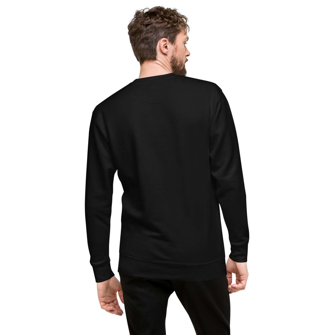 Back view of a man wearing an Earthlets unisex premium sweatshirt in black, showcasing its stylish design.