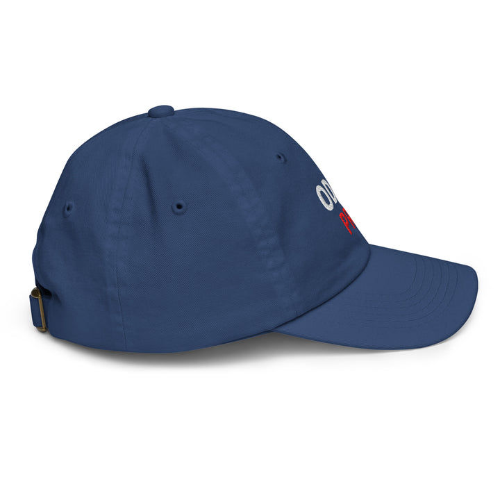 Side view of the Oddy Pro Youth baseball cap in navy blue with adjustable strap and embroidered logo.