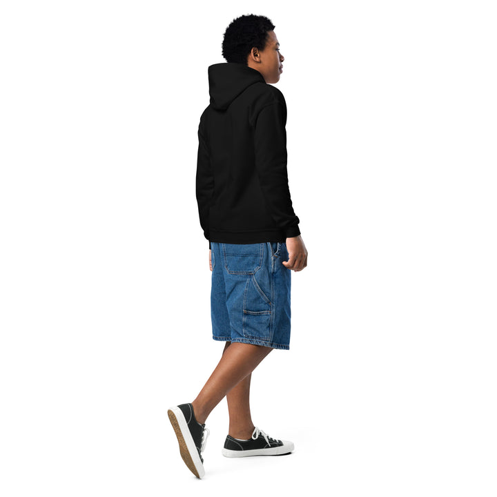 Boy wearing an Oddy Pro Youth heavy blend hoodie, styled with denim shorts and sneakers.