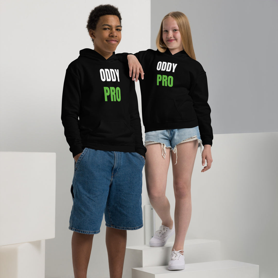 Two children wearing Oddy Pro Youth heavy blend hoodie, showcasing stylish design in black with green text.