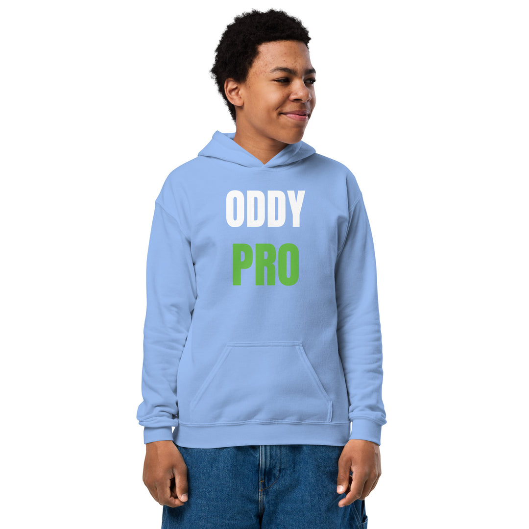 Oddy Pro Youth heavy blend hoodie worn by a cheerful child in a light blue color, featuring bold text design.