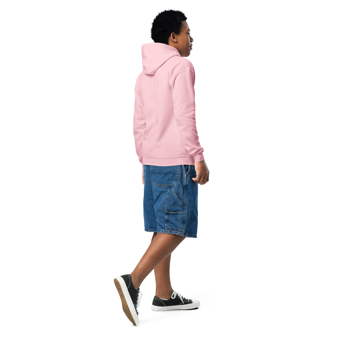 Boy wearing Oddy Pro Youth heavy blend hoodie in pink, paired with denim shorts, showcasing casual style and comfort.